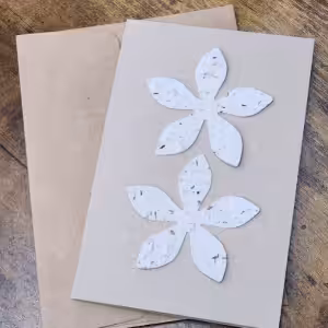 Card flower-shaped cutouts made of textured material