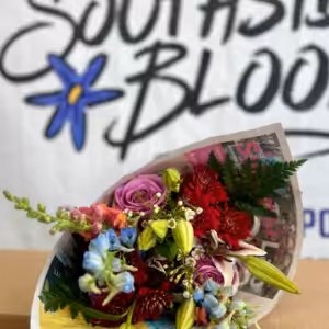 Flower bouquet wrapped in newspaper