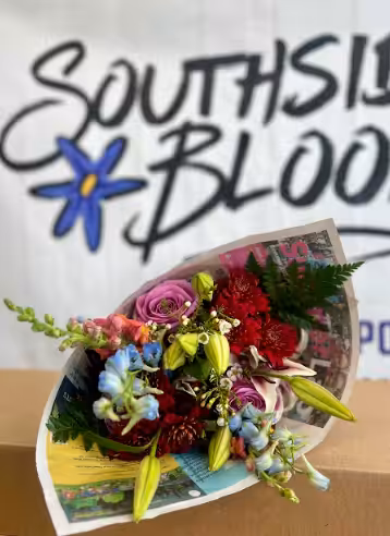 Flower bouquet wrapped in newspaper