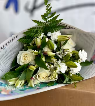 Screenshot-2024-04-03-173221 Bouquet of white roses and lilies wrapped in newspaper